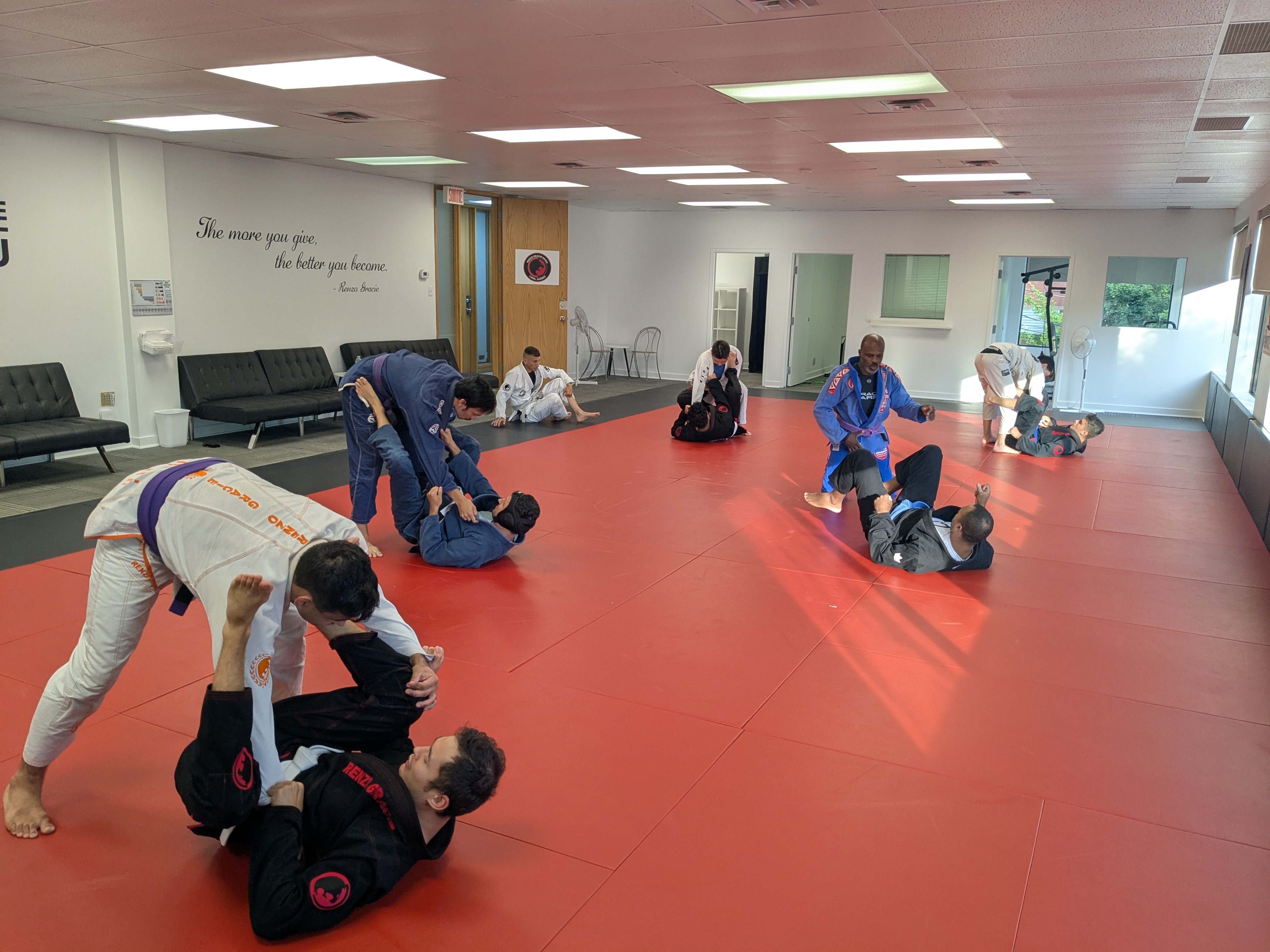 Adult BJJ rolling and drilling at Renzo Gracie Laval